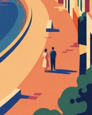 A couple on the orange promenade, between the bay and sunlit façades