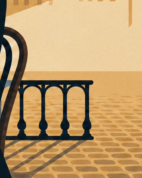 Balustrade en fer noir sur un sol pavé ocre, avec l'ombre portée d'une chaise bistrot