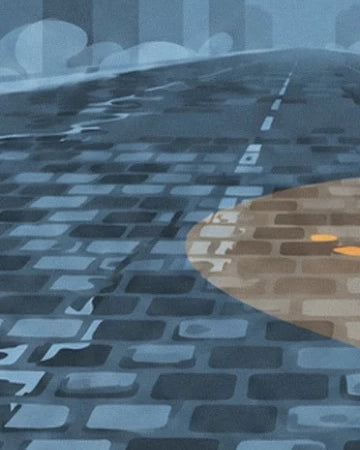 The blue cobbles of the street, bathed in golden light on the right