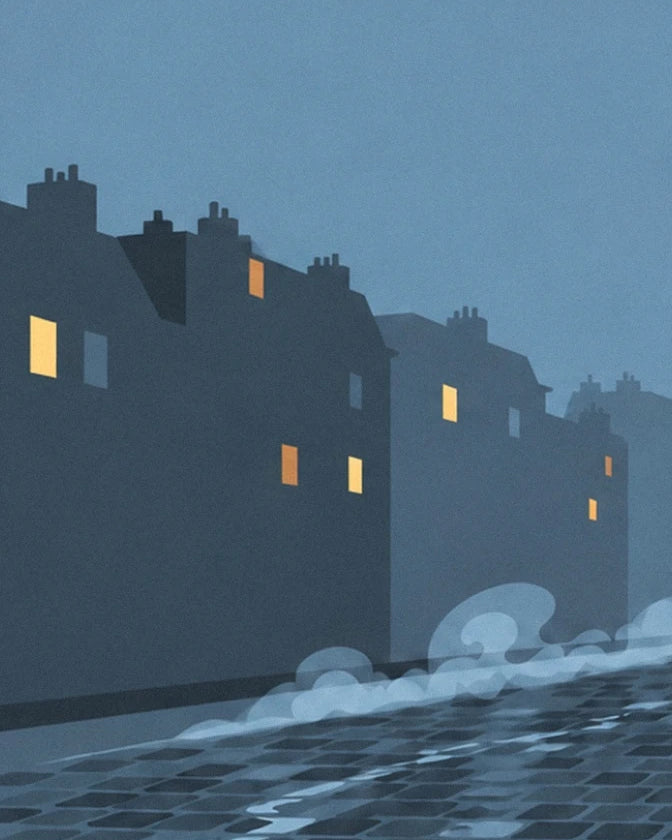 The dark façades with yellow windows beneath the blue night sky