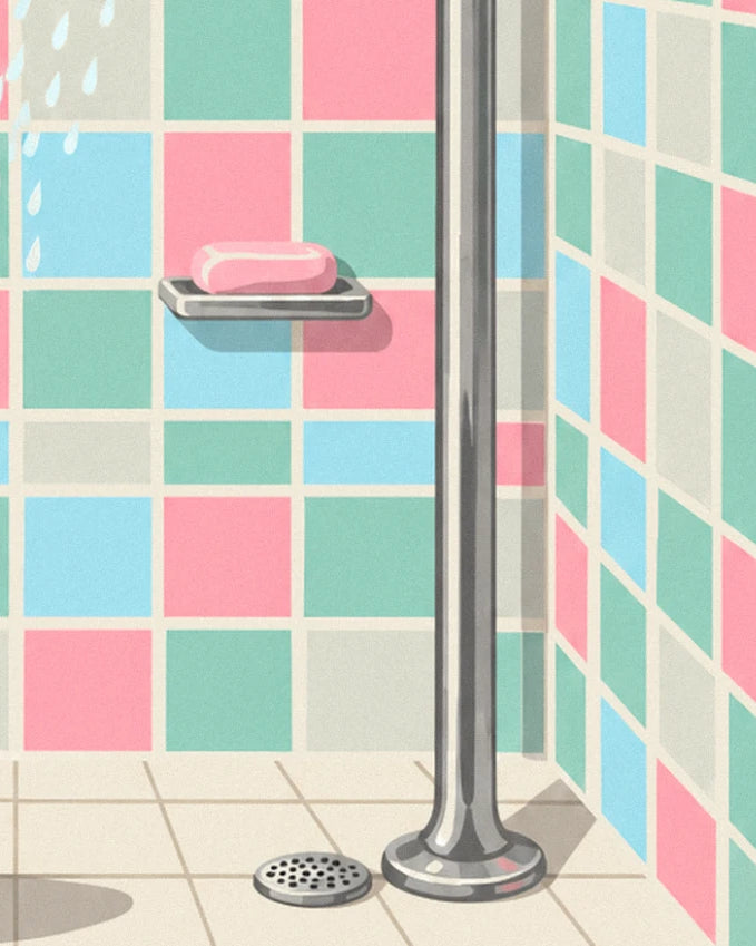 The pink soap on its chrome holder, beside the shower pipe and drain
