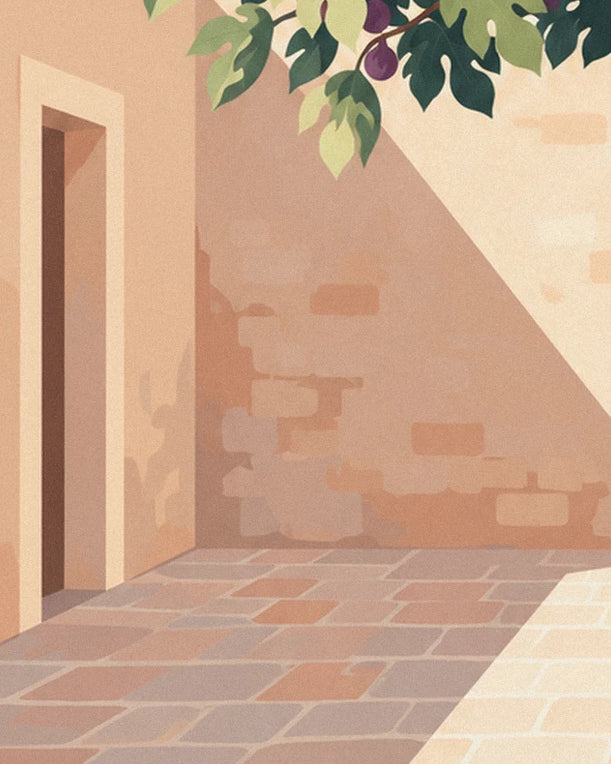 The ochre stone wall, its dark doorway and the courtyard paving in the shade of the branches