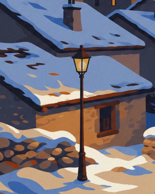The glowing street lamp outside the stone house with snow-covered roofs