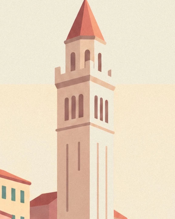 The bell tower with cream and pink façades topped with a pointed red roof