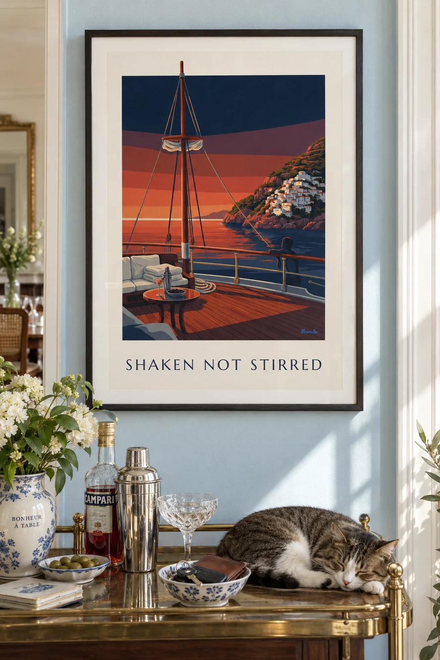Poster of a shaker and martini glass on a sailboat deck: framed on the wall