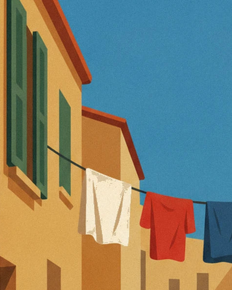White, red and blue washing on a line between 2 ochre façades with green shutters