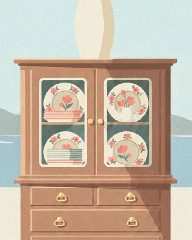 The wooden dresser with glass-fronted cupboards, plates with pink flowers and golden handles