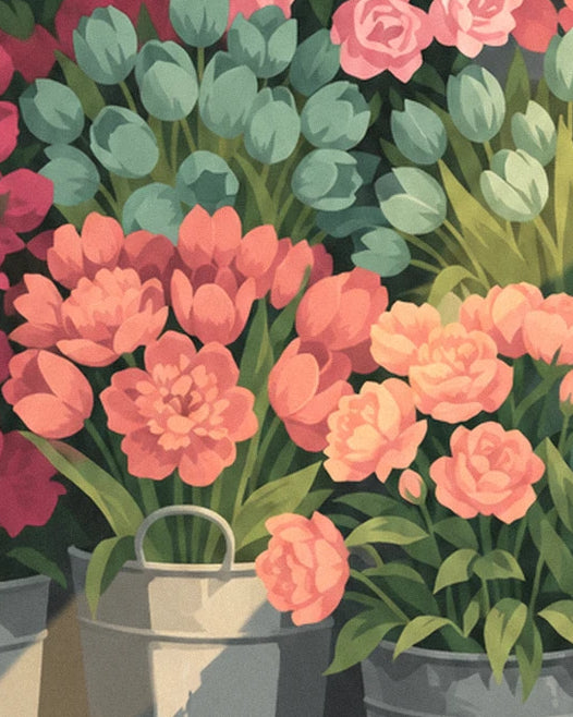 Coral flowers and soft green tulips in buckets at the flower market