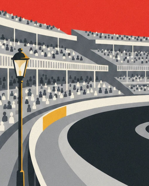 Stands packed with spectators and a black and gold street lamp, beside the curving track