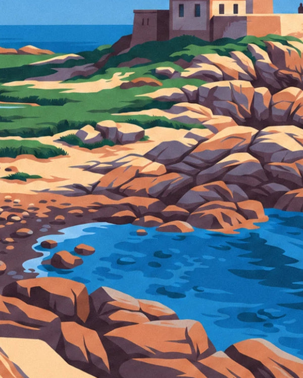 The ochre rocks and green grass around a blue-water cove, below the lighthouse buildings