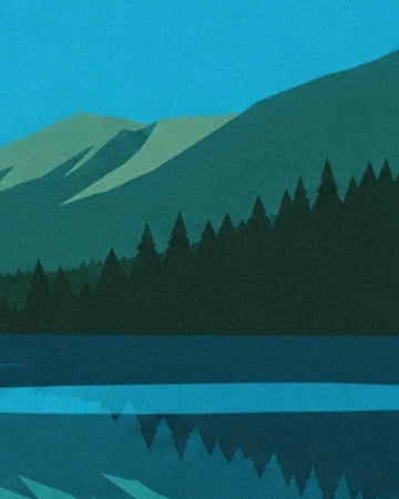 Les sapins vert sombre au pied des montagnes et leurs reflets dans le lac turquoise