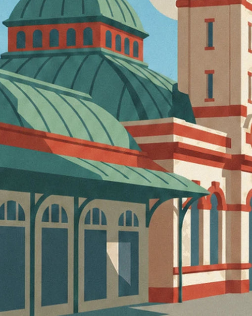 The verdigris glass canopy and the station's red and cream façade, with its large arches