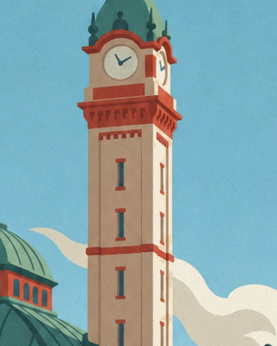 The tall clock tower in red and cream brick, beneath a blue sky