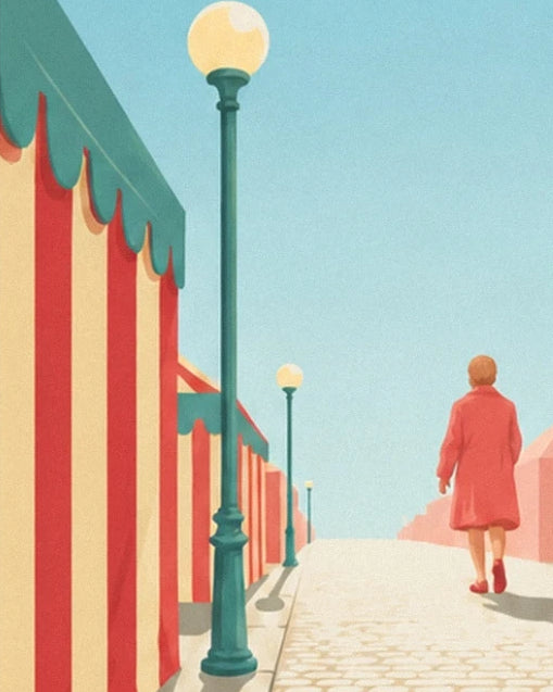 A woman in a red coat in an avenue lined with striped stalls and street lamps