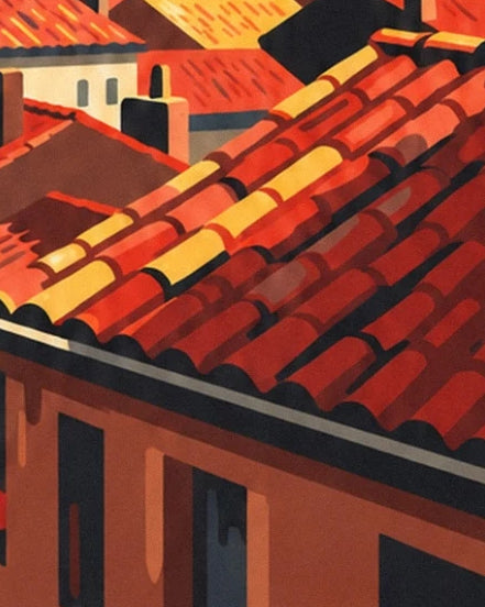 The red and golden roof tiles above a façade with dark windows