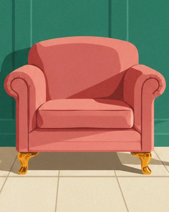 A coral pink armchair with rounded arms and golden legs on a tiled floor