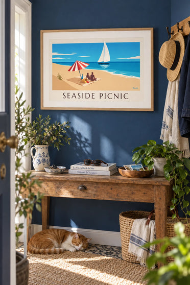 Poster of a seaside picnic under a striped parasol: framed on the wall