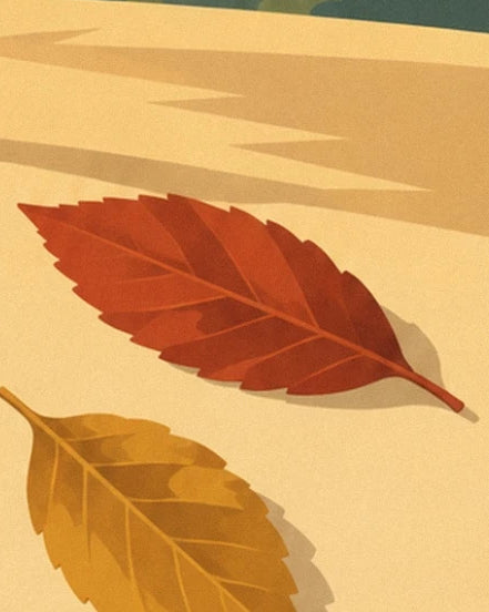 A red leaf with orange veins and an ochre leaf against a cream background