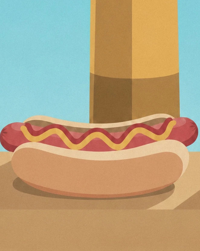 A hot dog topped with a line of yellow mustard on the snack bar counter