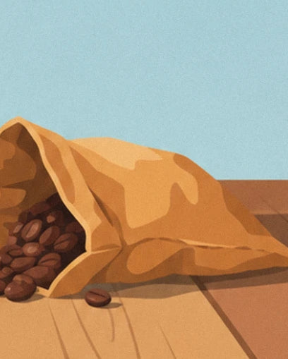 An overturned ochre paper bag and its coffee beans on a wooden table