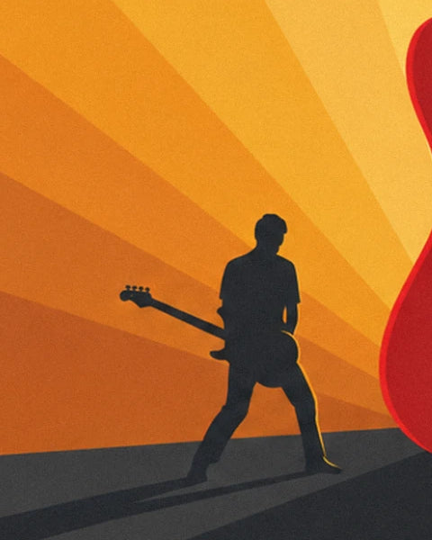 The guitarist in black silhouette, bass in hand, on the orange stage