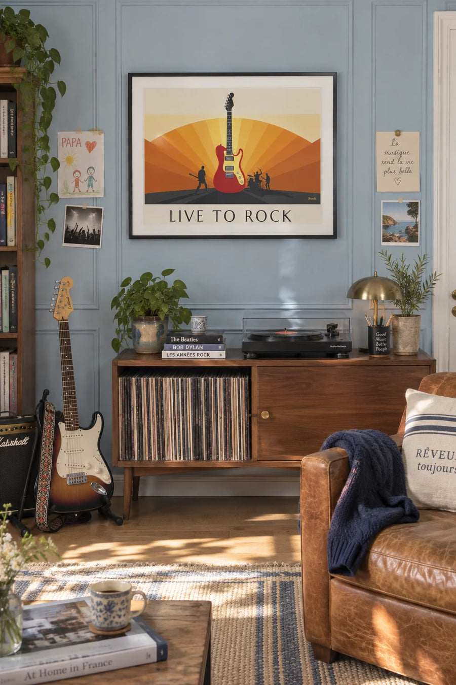 Poster of an electric guitar and silhouettes of rock musicians: framed on the wall
