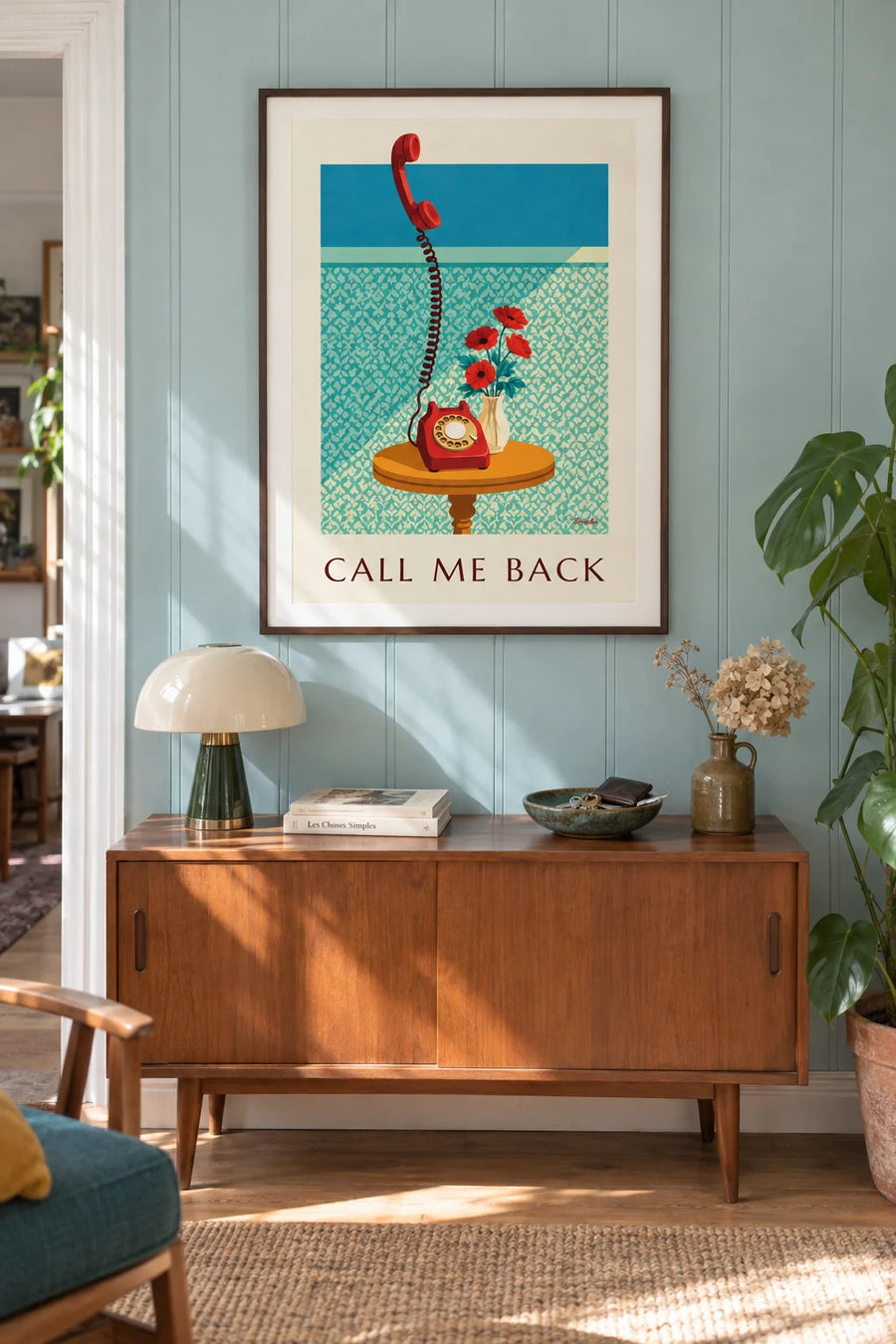Poster of a rotary dial telephone on a pedestal table: framed on the wall