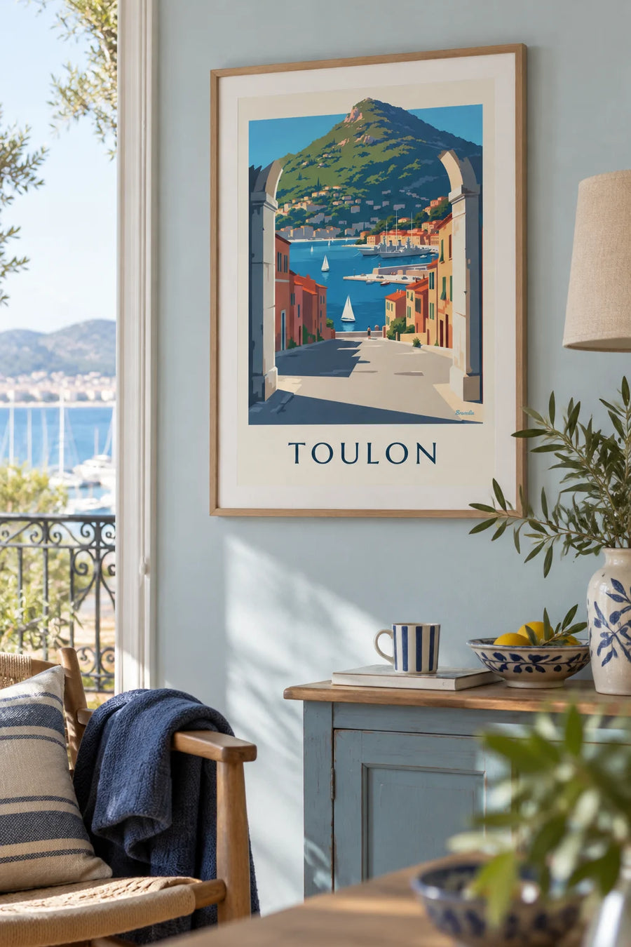 Poster of the port of Toulon seen through a stone arch: framed on the wall