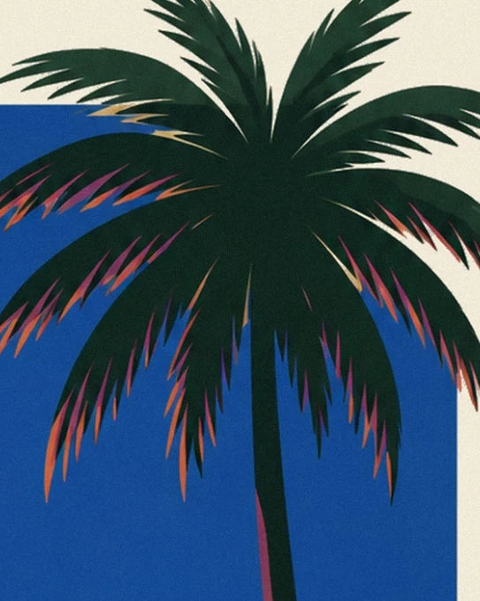 The long dark green fronds with pink highlights in front of the pale moon