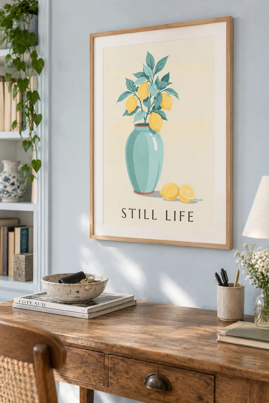 Poster of a lemon tree branch in a ceramic vase: framed on the wall