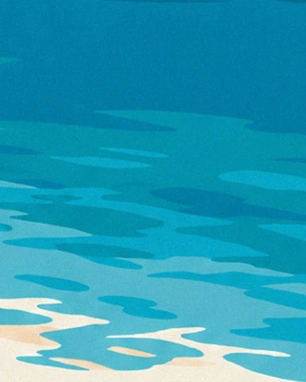 Turquoise and blue reflections in the sea, edged with white foam on the sand