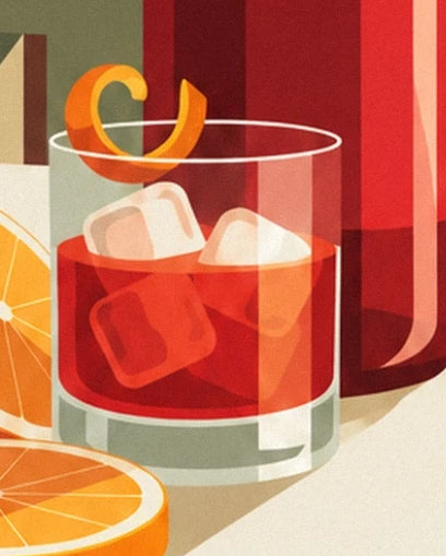 A red Negroni with translucent ice cubes, a twist of orange peel and orange slices