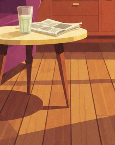 The glass and newspaper on the yellow table, above the sunlit parquet floor