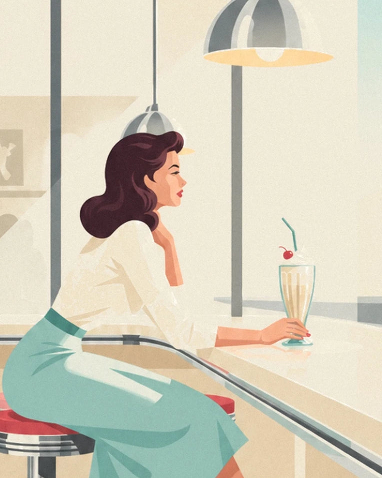 La pin-up en jupe turquoise et son milk-shake à la cerise, accoudée au comptoir
