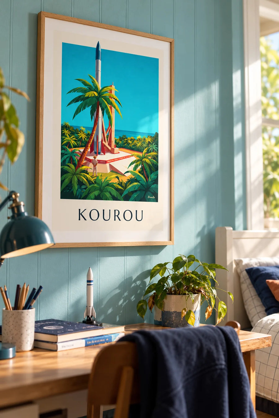 Poster of a rocket on its launch pad in Kourou, French Guiana: framed on the wall