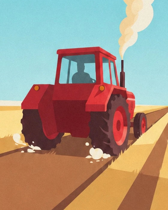 The red tractor and its driver among the furrows of the golden field