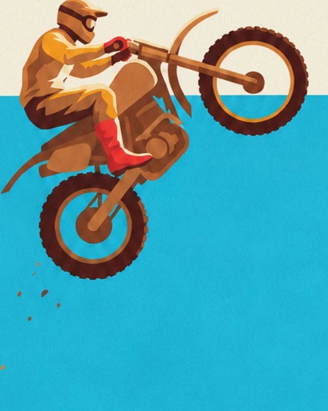 The rider in ochre clothing and red boots, with his motorbike rearing up against the blue sky