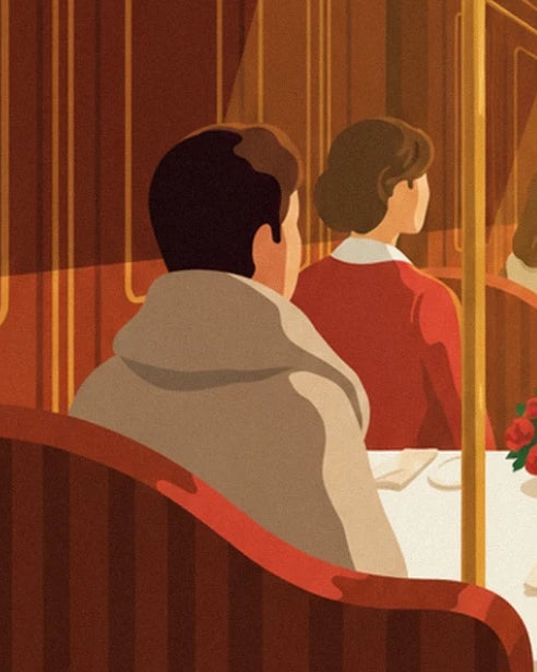 The passengers seen from behind, in a beige jacket and in red, on the bench seats of the dining carriage