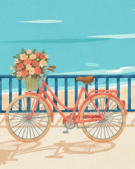 Le vélo corail au panier fleuri devant la rambarde bleue et la mer turquoise