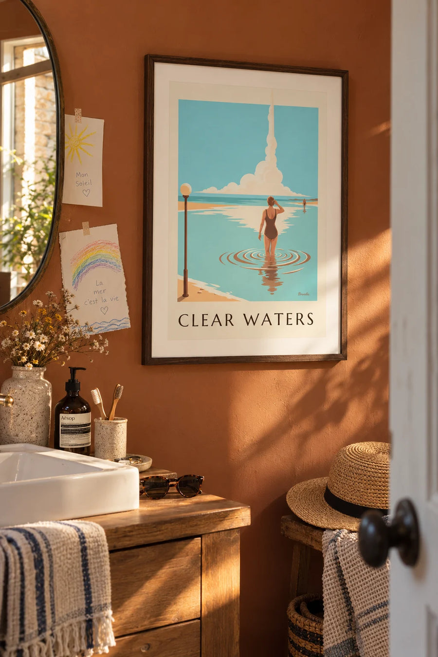 Poster of a swimmer seen from behind in clear, transparent water: framed on the wall