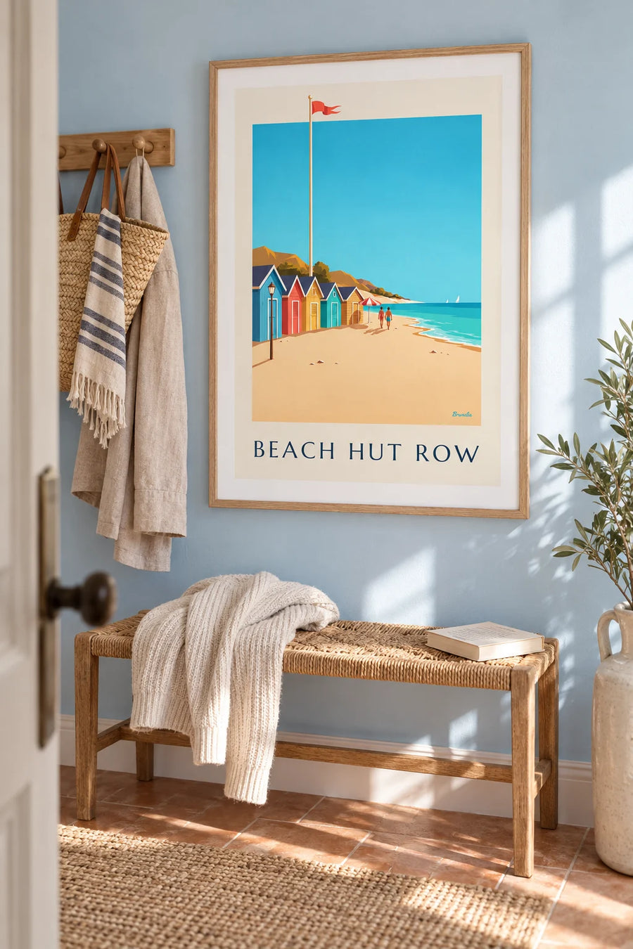 Poster of a row of colorful beach huts by the sea: framed on the wall