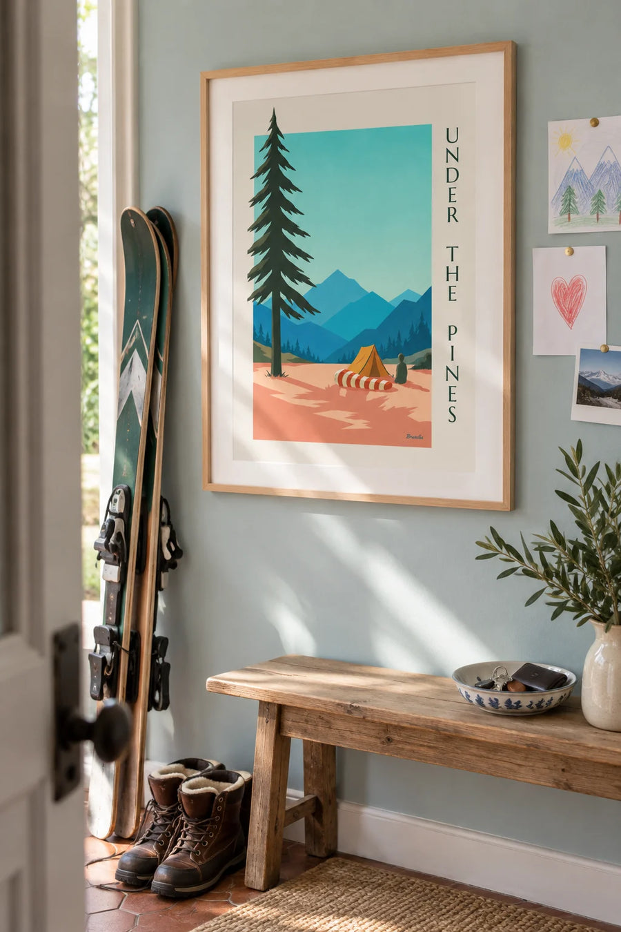 Poster of a striped sleeping bag and tent among the pines: framed on the wall